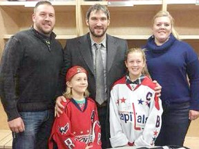 Clockwise from the top left; Dennis, Alex, Miranda, Mikailah and Cash met in the Washington Capitals’ dressing room in Calgary on Oct. 30.