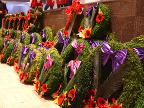 Wreaths donated by families, organizations, businesses, and government officials line the front of the stage at the Community Hall during last year's Remembrance Day Ceremony.