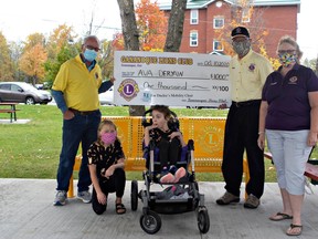 The Gananoque Lions Club presented Ava Deryaw with a $1,000 cheque to go toward the purchase of a new wheelchair for Ava’s friend, Ducky Steacy. Photo submitted by the UCDSB.