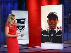 SECAUCUS, NEW JERSEY - OCTOBER 06: Jamie Hersch of the NHL Network interviews Quinton Byfield of Sudbury of the OHL after his selection by the Los Angeles Kings in the 2020 National Hockey League Draft at the NHL Network Studio on October 06, 2020 in Secaucus, New Jersey. (Photo by Mike Stobe/Getty Images)