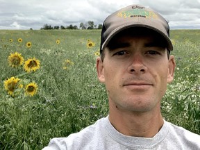 Stuart Chutter with one of the acres he's regenerating through a mix of warm and cool season grasses and legumes, broadleaf, sunflower and chicory.  (DIANA MARTIN, Ontario Farmer)