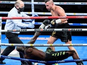 David Lemieux, right, knocks down Francy Ntetu, bottom, at a boxing event Oct. 10 in Shawinigan.