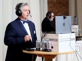 Socially distanced co-chairpersons Chris McLeod, left, and Tim Regan host the Festival of Giving's virtual party at the Chatham Armoury in Chatham, Ont., on Saturday, Oct. 17, 2020. Mark Malone/Chatham Daily News/Postmedia Network