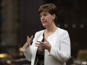Minister of Agriculture and Agri-Food Minister Marie-Claude Bibeau rises during a sitting of the Special Committee on the COVID-19 Pandemic in the House of Commons, in Ottawa, Wednesday, June 3, 2020. (THE CANADIAN PRESS/Adrian Wyld)