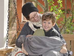 Christina Hotz and her four-year-old son Kitron cuddle and relax on their Toronto Street West porch in Mitchell. Hotz contracted the coronavirus back in March, and said six months later she still doesn't feel her normal self. She's urging people to take COVID-19 seriously. ANDY BADER/MITCHELL ADVOCATE