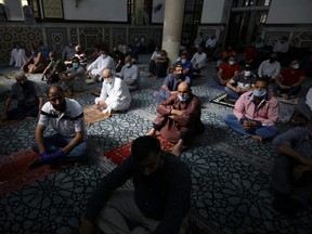 Muslims take part in Friday prayers at al Husseini mosque after the government allowed worshipers to break a blanket ban for an hour and walk to mosques, amid fears over rising numbers of the coronavirus disease (COVID-19) cases in downtown Amman, Jordan October 23, 2020.