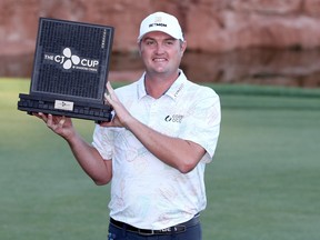 Jason Kokrak poses with the winner's trophy after the final round of the CJ Cup @ Shadow Creek on October 18, 2020 in Las Vegas, Nevada (Photo by Matthew Stockman/Getty Images)