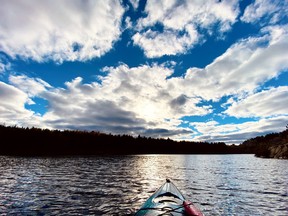 Not quite a sunset, but I was witness to some dramatic and rather beautiful skies while kayaking on Lake Laurentian on Thanksgiving weekend. I captured this shot while paddling back to shore after Koral got a bit tippy.