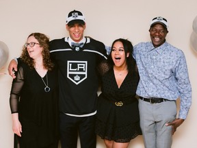 Quinton Byfield and his mother Nicole, sister Chloe and father Clinton share a laugh while posing for a photo after the Los Angeles Kings made him their first-round pick, second overall, in the 2020 NHL Entry Draft on Tuesday night.