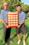 In-town captain, Ron VanLeuvenhage, left, receives the plaque from Don Butcher, chair of the men’s tournament, at the Delhi Golf and County on Sept. 27. The men celebrated the 20th anniversary of the Delhi Ryder Cup. In-town teams hold a 13-7 advantage. (CONTRIBUTED)