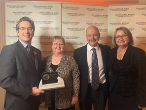 Bookended by Mayor Rod Frank and former Chamber president Cathy Olesen, Sherwood Park Bowl owners Wendy and Scott Wiseman were given the Community Attraction Award by the Chamber in 2019. Award nominations for the 2020 hybrid event are open until Friday, Oct. 23. Lindsay Morey/News Staff/File
