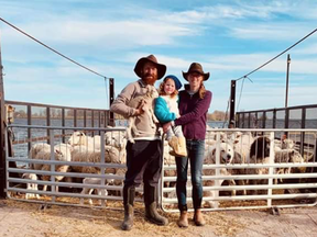 Matthew, his daughter Thora and his wife Liz Johnston. As the barge is ready to leave shore for pasture on Waupoos Island.
