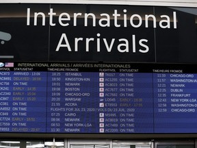 The international arrivals are posted at Toronto Pearson International Airport, July 22, 2020.