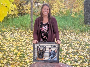 Haley Mulder, who was born in Banff, shows some of her pet portrait woodcarvings.