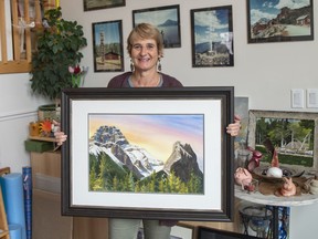 Claudia Schellenberg holds one of her pieces in her Canmore home and studio. photo by Pam Doyle/www.pamdoylephoto.com
