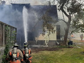 Belleville fire fighters battle a house fire on Doxtator Drive in Point Anne just before noon Saturday. The home was completely destroyed with a loss of $250,000 while one male occupant was treated for burns to his legs, arms and torso area at Belleville General Hospital and then released.
DAVE MACMULLEN PHOTO