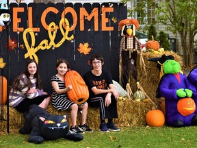 Foxboro youngsters of the Galpin family in Foxboro, Brianna, Faith and Benjamin, have decorated the front lawn of their Ashley Street home to welcome trick-or-treaters on Halloween night using approved physical distancing and face mask protocols issued by the Ontario Ministry of Health Monday. DEREK BALDWIN