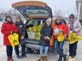 EXIT Realty Group agents collect food for Gleaners Food Bank at Marc's No Frills in Belleville recently.
SUBMITTED PHOTO