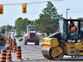 Traffic lights on reconstructed Bell Boulevard will be synchronized to ensure smoother traffic flows in the high-traffic commercial zone, said city officials. DEREK BALDWIN