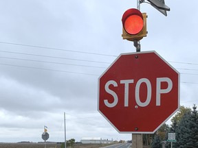 Solar powered red flashing lights were installed atop stop signs at the intersection of Highway 23 and Perth Line 44 in Bornholm Oct. 29. Many neighbours say the extra safety feature is long overdue. ANDY BADER/MITCHELL ADVOCATE