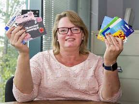 Heather Vanner, executive director of Community Resource Service that oversees the annual Christmas Baskets program, holds a variety of gift cards that are ideal to be donated.