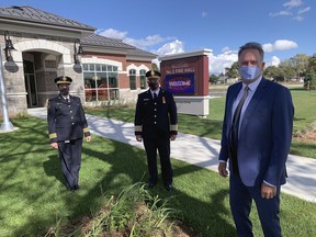 Deputy Chief Anna Everett, Chief Todd Binkley and Mayor Kevin Davis stand outside the new No. 2 fire hall on Fairview Drive on Wednesday. They were among the small group to participate in a grand opening for hall, which will become operational on Oct. 13. Vincent Ball