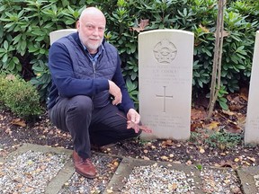 Freerk Boekelo, of the Netherlands, beside the grave of Flight Sgt. Frank Leonard Cooke, of Brantford.