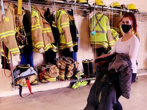 Short-listed applicants to the Brant County fire service attended the firehall in Paris Saturday to take part in a number of strength and aptitude tests. Here, potential recruit Nicole Raposeiro, 31, of Brantford, performs a victim body drag through a pylon obstacle course. – Monte Sonnenberg