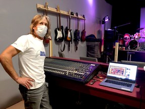 Willy Stevenson poses by the sound board at the newly opened Aaron Stevenson Memorial Musical Instrument Lending Library (Aaron's M.I.L.L.) at the Brockville Shopping Centre on Wednesday. (RONALD ZAJAC/The Recorder and Times)