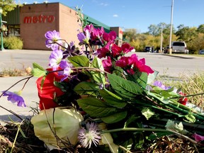 Flowers lie as a memorial near the spot where Parinaz Motahedin was killed Saturday morning in a collision at the intersection of King Street West and Clarissa Street. (RONALD ZAJAC/The Recorder and Times)