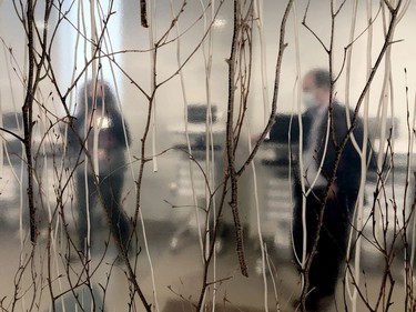 BGH spokeswoman Abby McIntyre and president and CEO Nick Vlacholias are seen through one of the glass dividers in a dining area in the Donald B. Green Tower. The new building incorporates designs inspired by the area's natural surroundings. (RONALD ZAJAC/The Recorder and Times)