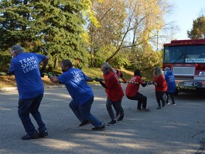 The Smith Family Legacy Team goes first in the George E. Smith Memorial Fire Truck Pull at the YMCA in Brockville on Saturday morning. The annual fundraiser was renamed in honour of the long-time Y supporter and former Brockville mayor who died in August.
Tim Ruhnke/The Recorder and Times