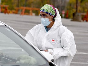 Randi Livius, a registered nurse, does intake at the Brockville COVID-19 assessment centre on Wednesday afternoon. (RONALD ZAJAC/The Recorder and Times)