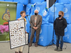 From left, Bee City Canada founder Shelly Candel presents a certificate to Augusta mayor Doug Malanka and councillor Tanya Henry declaring the township a 'Bee City' during the Fall Harvest event the municipality held at V6 Agronomy in North Augusta on Thursday afternoon.
Tim Ruhnke/The Recorder and Times