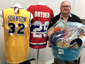 Mike Genge, president of the Children's Treatment Centre Foundation Chatham-Kent, displays some of the items that will be available to bid on during the online auction for the upcoming Festival of Giving. Submitted