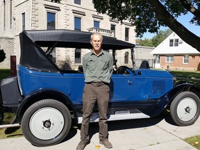 Auto restorer Stan Uher is shown with a 1923 Gray-Dort in front of the former Chatham jail on Thursday. He was recreating a photo taken with one of the vehicles in the same location during that era. (Trevor Terfloth/The Daily News)