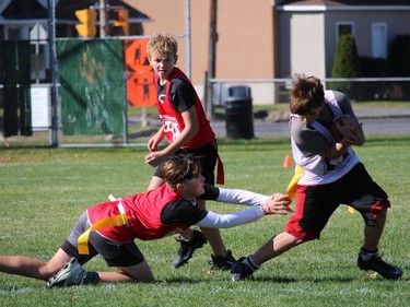 Ball carrier Austin Doucette weaves his way past defenders in a Cornwall Wildcats flag football peewee division game at Joe St. Denis Field. Photo on Sunday, October 12, 2020, in Cornwall, Ont. Todd Hambleton/Cornwall Standard-Freeholder/Postmedia Network