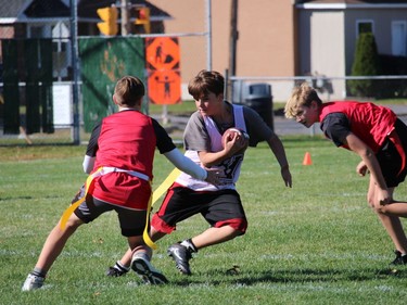 Ball carrier Austin Doucette weaves his way past defenders in a Cornwall Wildcats flag football peewee division game at Joe St. Denis Field. Photo on Sunday, October 12, 2020, in Cornwall, Ont. Todd Hambleton/Cornwall Standard-Freeholder/Postmedia Network