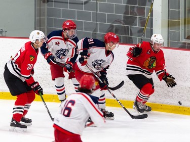 Brockville Braves Josh Spratt chases the puck in the corner as a number of Cornwall Colts give chase stick during pre-season play on Sunday October 11, 2020 in Cornwall, Ont. 
Robert Lefebvre/Special to the Cornwall Standard-Freeholder/Postmedia Network