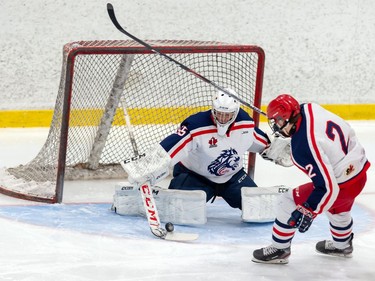 Cornwall Colts goaltender deflects a Brockville Braves shot as a teammate skates past during pre-season play on Sunday October 11, 2020 in Cornwall, Ont. 
Robert Lefebvre/Special to the Cornwall Standard-Freeholder/Postmedia Network