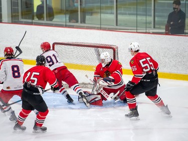 Brockville Braves and Cornwall Colts players chase a rebound off the Braves' goaltender, during a pre-season scrimmage between the two teams on Saturday October 3, 2020 in Cornwall, Ont. 
Robert Lefebvre/Special to the Cornwall Standard-Freeholder/Postmedia Network