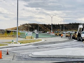 Crews put the finishing touches on the connection to Griffin Road on October 8. Many local drivers are about to find their commutes about town a little quicker with the Jack Tennant Memorial Bridge scheduled to be open to vehicles on October 16. Patrick Gibson/Cochrane Times