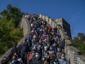 hinese tourists crowd in a bottleneck as they move slowly on a section of the Great Wall at Badaling after tickets sold out during the 'Golden Week' holiday on October 4, 2020 in Beijing, China.