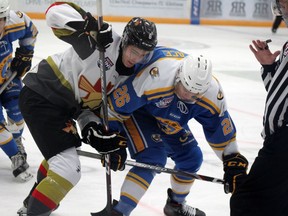 Fort McMurray Oil Barons forward Tyler Wallace and Bonnyville Pontiacs forward Vincent Lamanna battle for the puck at the Centerfire Place on Saturday, October 24, 2020. Laura Beamish/Fort McMurray Today/Postmedia Network