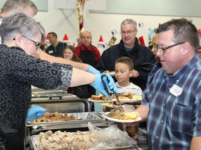 Food is served at Father Turcotte School for the annual Christmas meal hosted by the Fort McMurray Knights of Columbus on Wednesday, December 25, 2019. Vincent McDermott/Fort McMurray Today/Postmedia Network