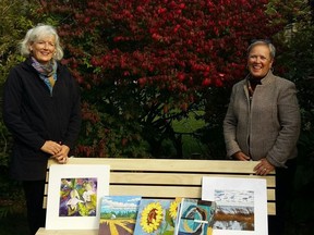 Cindy Fisher (left) and Laurel Armstrong (right) with some of the art. Submitted