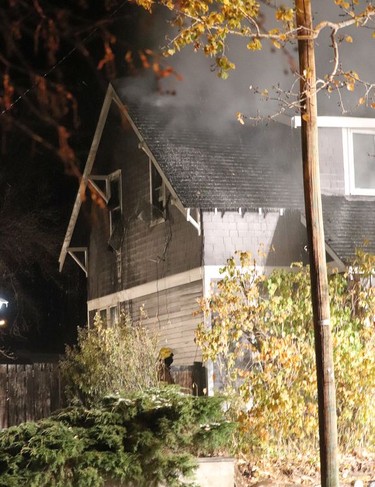 A fire broke out in the 100 block of Sixth Ave West late in the night on Oct. 18. The owner and pet were able to make it to safety, however the fire spread to the attic making extinquishing it difficult. Hanna Fire Department battled the blaze into the early hours of Oct. 19, while Hanna RCMP lend an aid for crowd control at the height of the fire. Jackie Irwin/Postmedia