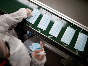 Protective face masks on a production line