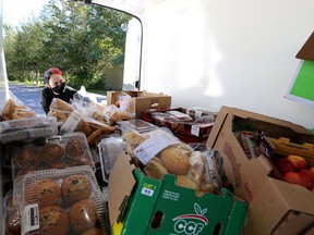 Morningstar Mission volunteer Hope Rose unloads a shipment of donated food from Lionhearts Inc. on Sept. 19 at the Napanee Lions Hall. Kingston city council is to consider financial support for Lionhearts' efforts to address food insecurity. (Meghan Balogh/The Whig-Standard)