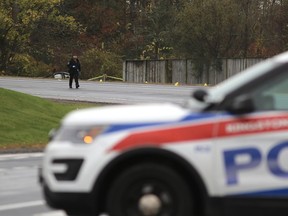 Kingston Police on Thursday, Oct. 22, investigate a fatal collision on Bayridge Drive that occurred on Wednesday, Oct. 21, evening. (Elliot Ferguson/The Whig-Standard)